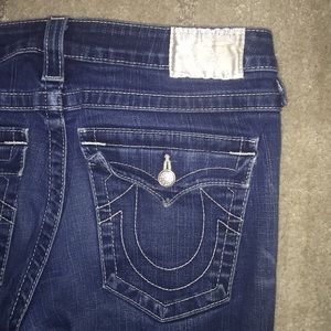 Rhinestones buttons. White satin label. Dark blue